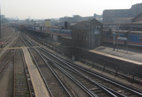 Railway tracks converging into a London station, seen from above