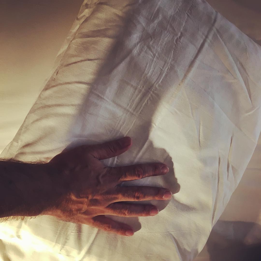 Hotel pillow. Hand for scale. (It's tiny) (The pillow not my hand)