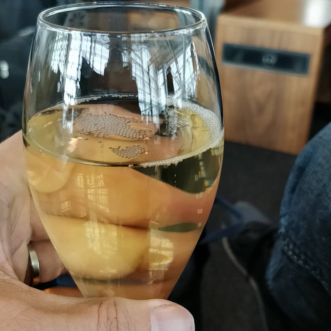 Flight delay has a silver lining. Time for some bubbles. 🍾