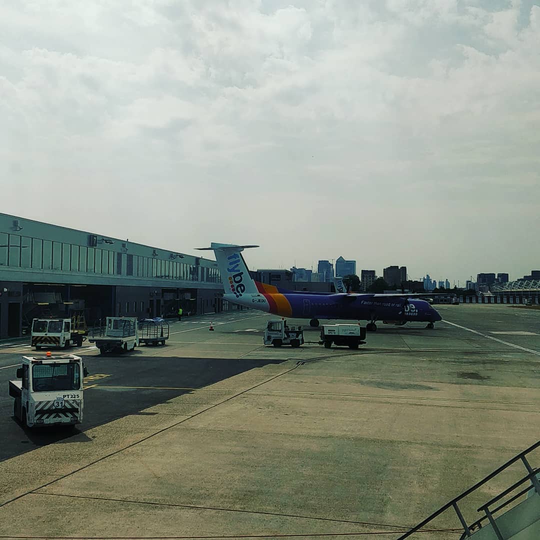 Goodbye London. See you soon Amsterdam. Flybe bombardier dash 8 Q400 at the next gate. Also heading to Amsterdam - it's a busy route!