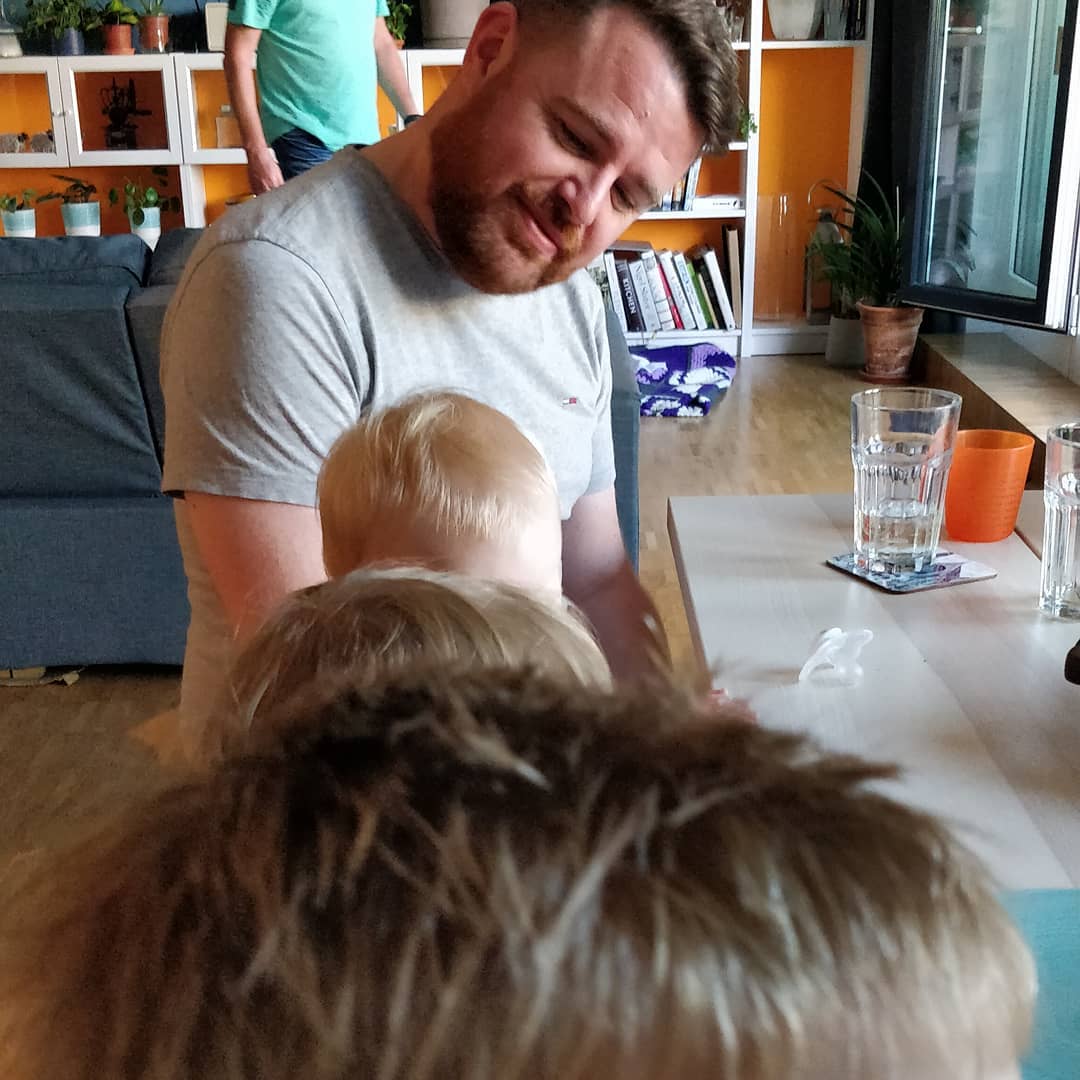 Practising his German at the kids table