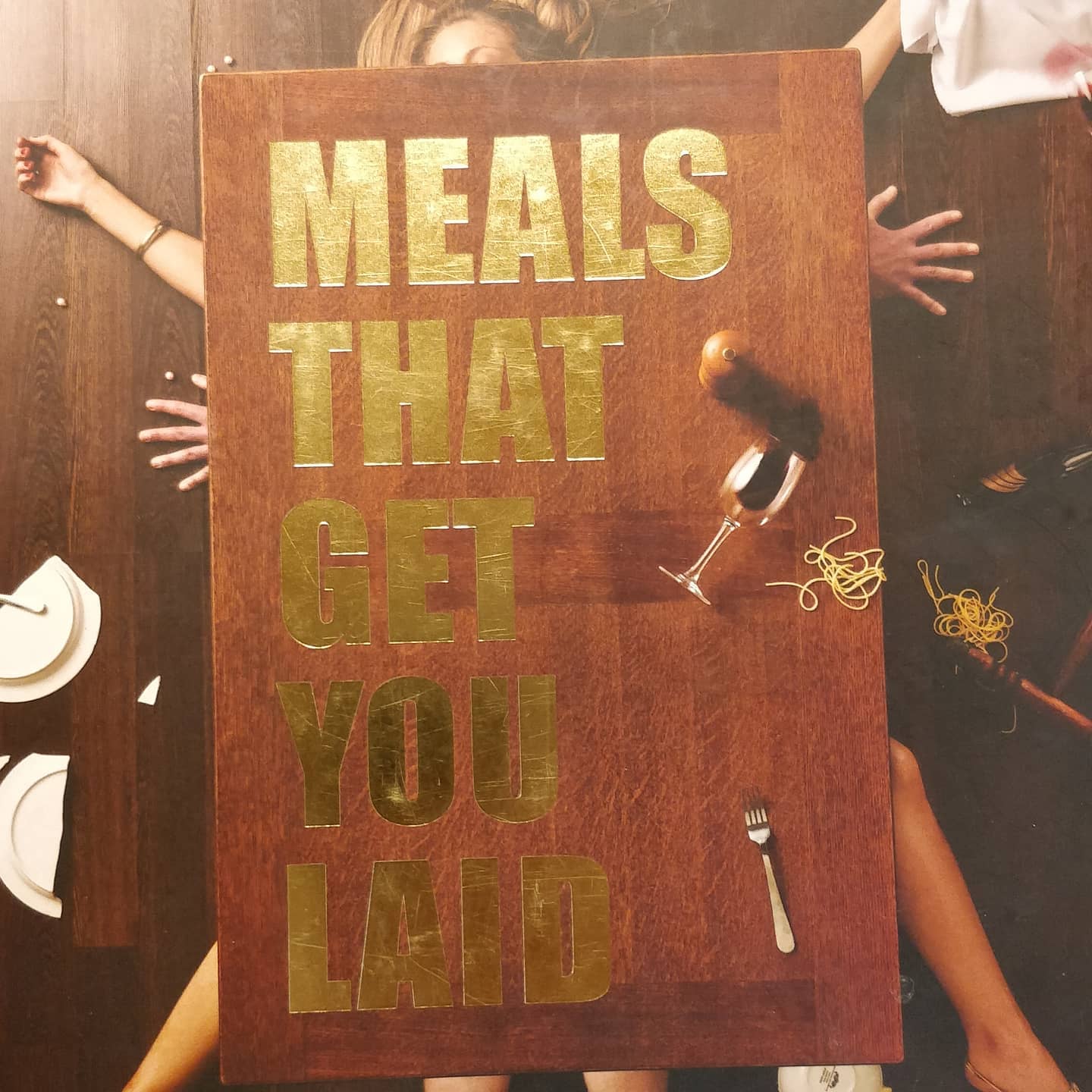 So this I think is not a cook book as such more.like soft porn. I'm not really understanding it except it seems to be a vehicle for images of scantily clad women with food. Anyway it's in the public lending library so (image 1 of 4)