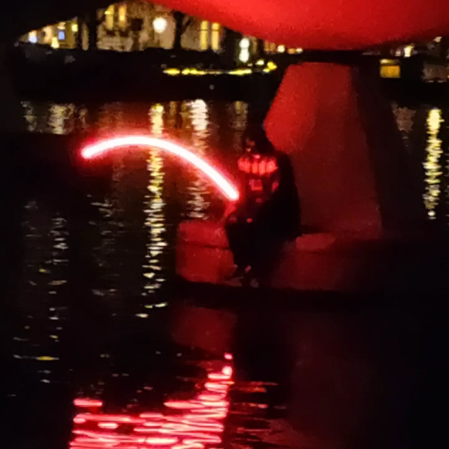 Darth Vader fishing in the Amstel. #amsterdamlightfestival #edition10